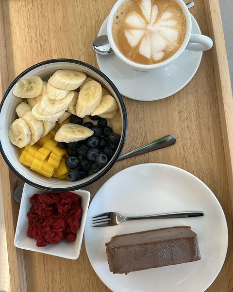 Healthy breakfast and latte — the Panthera Pilates wellness lifestyle